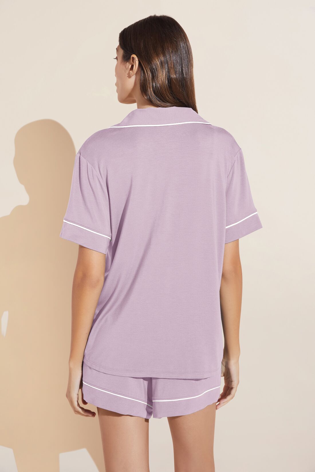 Model wears Gisele TENCELâ„¢ Modal Relaxed Short PJ Set in lavender/ivory.