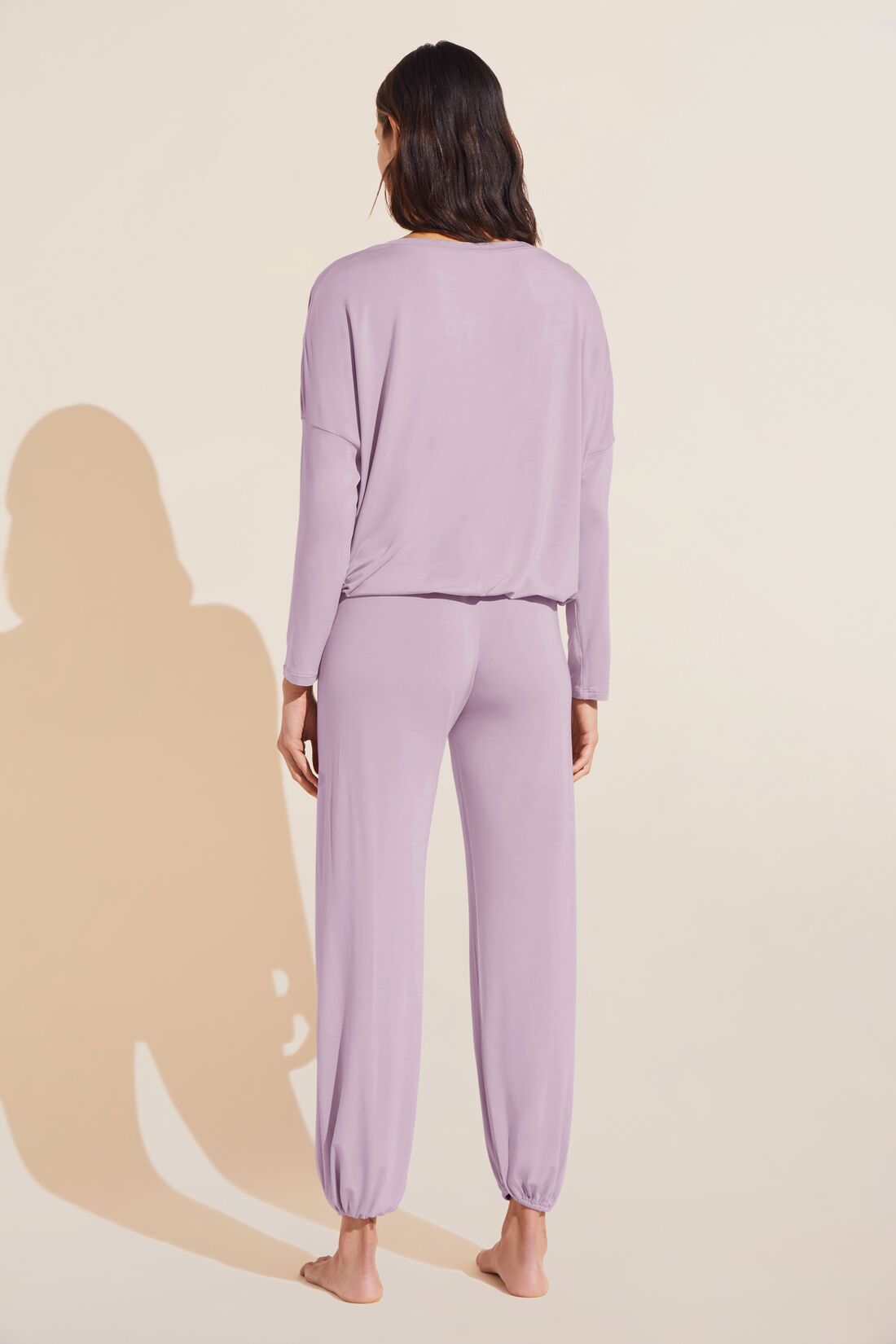 Model wears Gisele TENCELâ„¢ Modal Slouchy PJ Set in lavender/ivory.