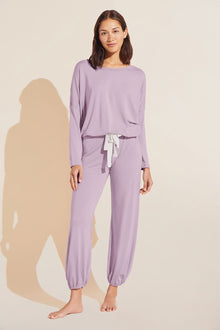 Model wears Gisele TENCELâ„¢ Modal Slouchy PJ Set in lavender/ivory.