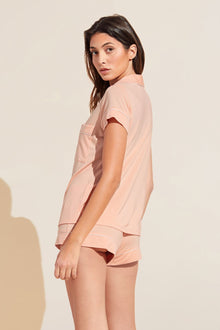 Model wears Model wears Gisele TENCELâ„¢ Modal Shortie Short PJ Set in peach parfait/ivory.