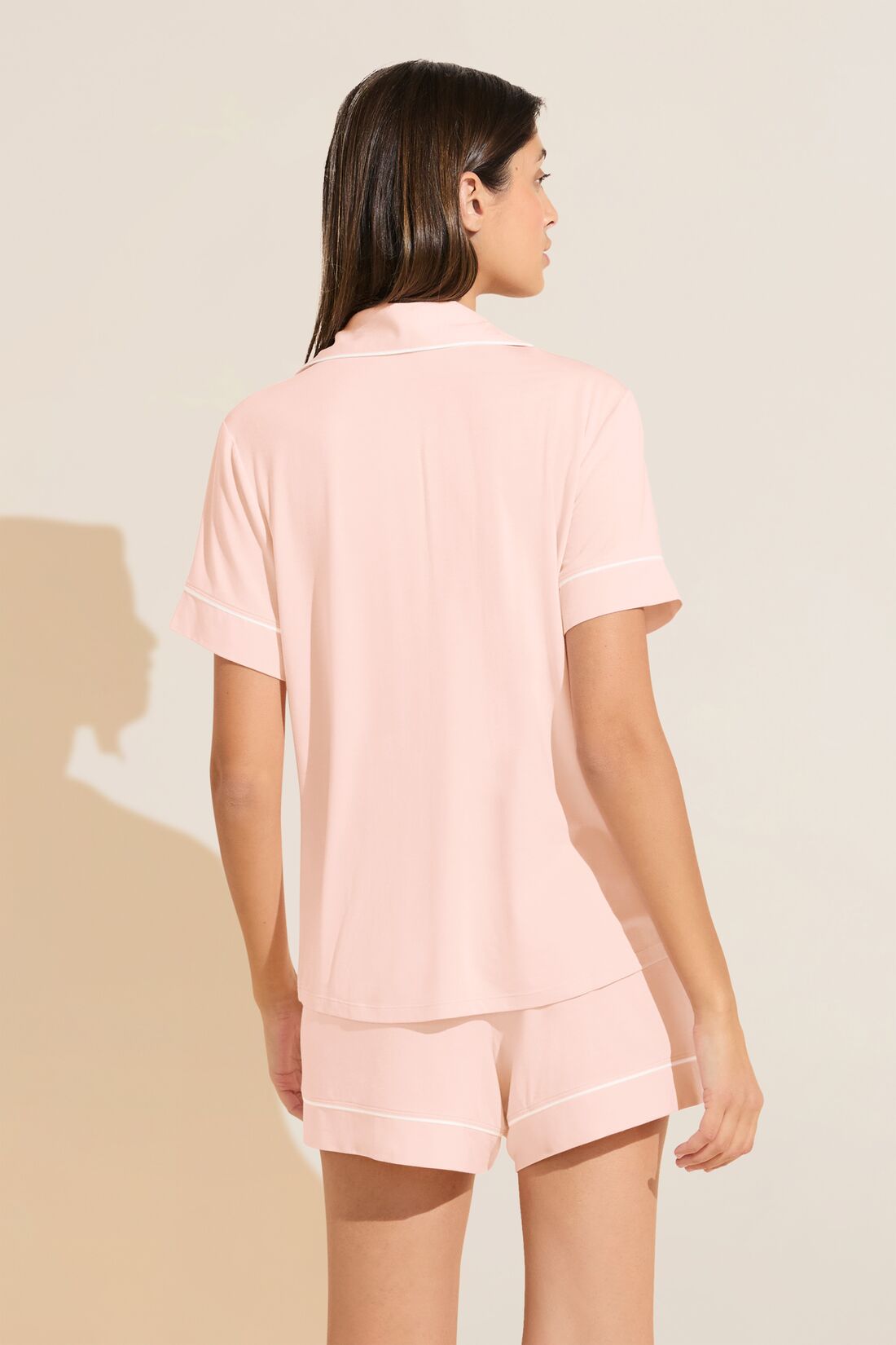 Model wears Gisele TENCELâ„¢ Modal Relaxed Short PJ Set in petal pink/ivory.