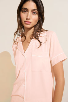 Model wears Gisele TENCELâ„¢ Modal Relaxed Short PJ Set in petal pink/ivory.