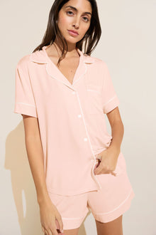 Model wears Gisele TENCELâ„¢ Modal Relaxed Short PJ Set in petal pink/ivory.