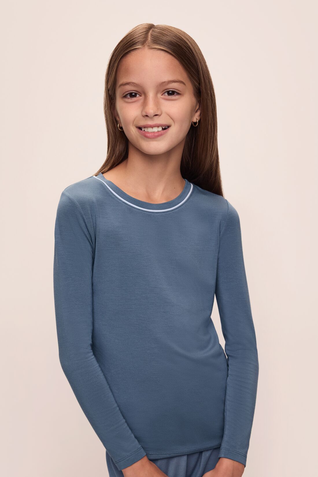 Model wears Kids TENCEL Modal Unisex Long PJ Set in Coastal Blue/Ice Blue.