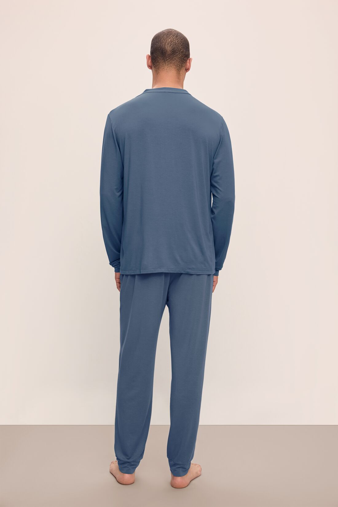 Model wears Henry TENCELâ„¢ Modal Long PJ Set in Coastal Blue.
