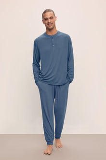 Model wears Henry TENCELâ„¢ Modal Long PJ Set in Coastal Blue.