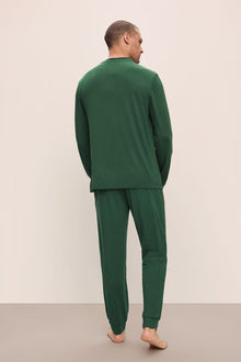 Model wears Henry TENCELâ„¢ Modal Long PJ Set in Forest Green.