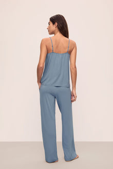 Model is wearing Gisele TENCEL Modal Cami & Pant PJ Set in Faded Denim