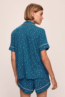 Model wears the Gisele Printed TENCELâ„¢ Modal Relaxed Short PJ Set in Festive Lights Sapphire/Ivory.