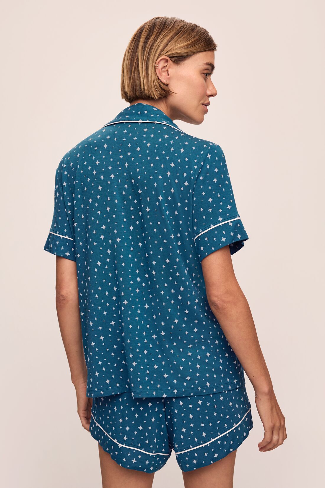 Model wears the Gisele Printed TENCELâ„¢ Modal Relaxed Short PJ Set in Festive Lights Sapphire/Ivory.