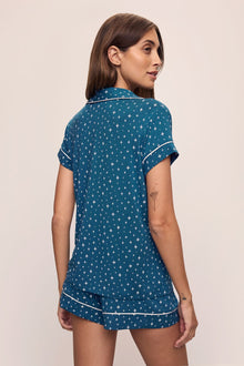 Model wears the Gisele Printed TENCELâ„¢ Modal Shortie Short PJ Set in Festive Lights Sapphire/Ivory.