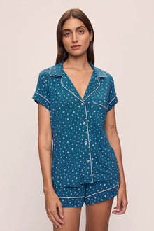 Model wears the Gisele Printed TENCELâ„¢ Modal Shortie Short PJ Set in Festive Lights Sapphire/Ivory.