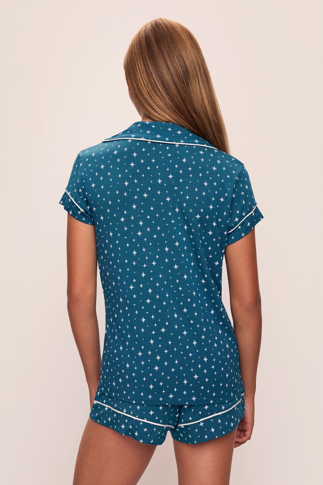 Model wears the Gisele Printed TENCELâ„¢ Modal Shortie Short PJ Set in Festive Lights Sapphire/Ivory.