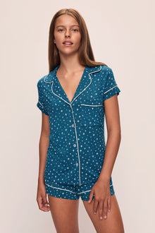 Model wears the Gisele Printed TENCELâ„¢ Modal Shortie Short PJ Set in Festive Lights Sapphire/Ivory.