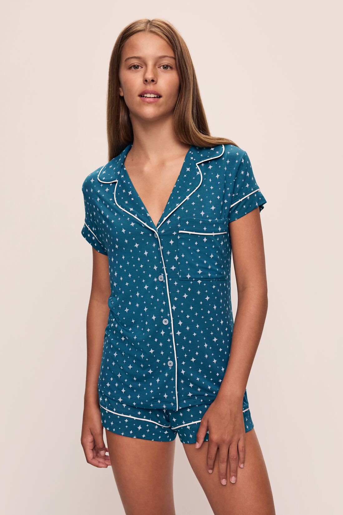Model wears the Gisele Printed TENCELâ„¢ Modal Shortie Short PJ Set in Festive Lights Sapphire/Ivory.