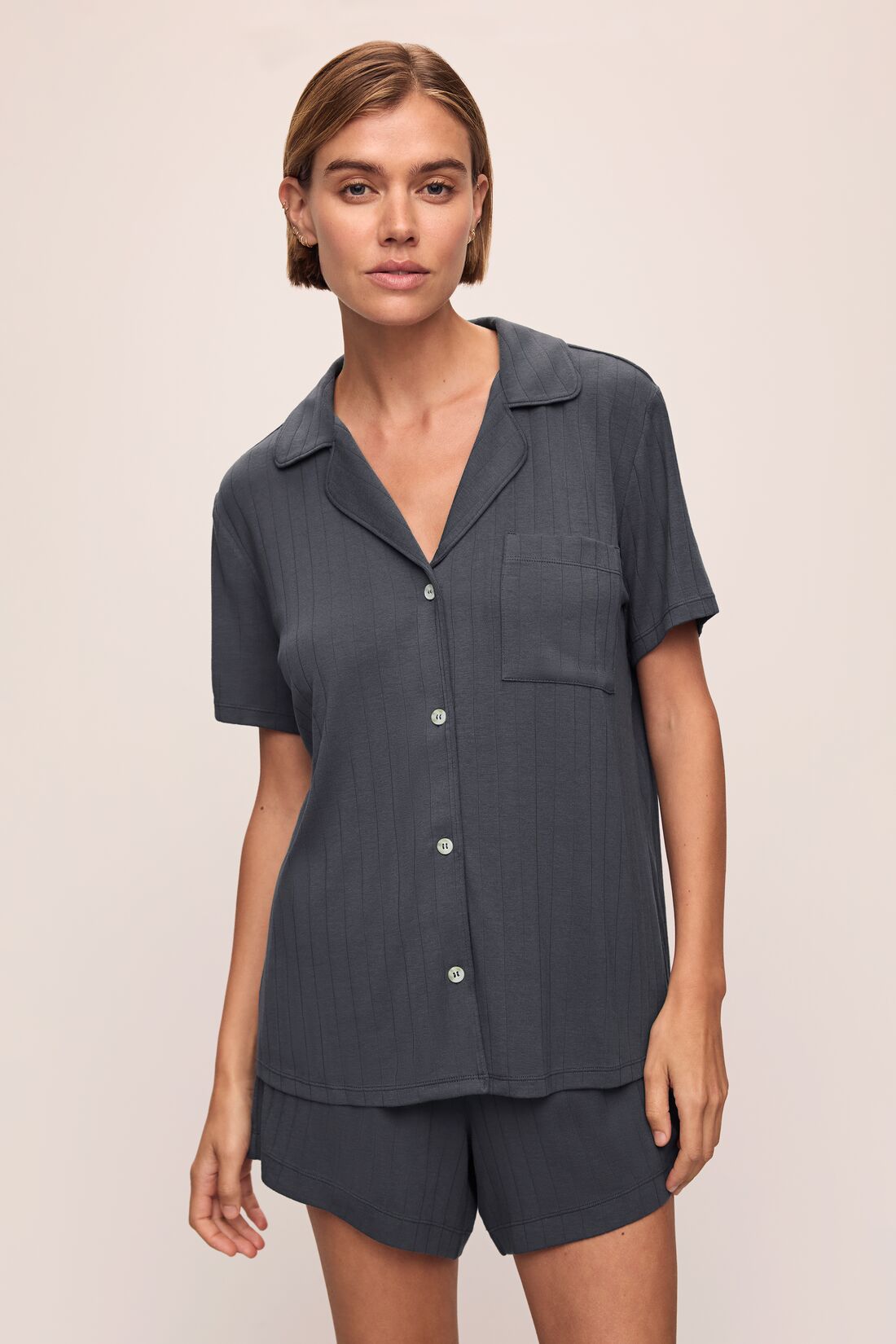 Model wears Gisele TENCEL Modal Rib Relaxed Short PJ Set in Graphite.