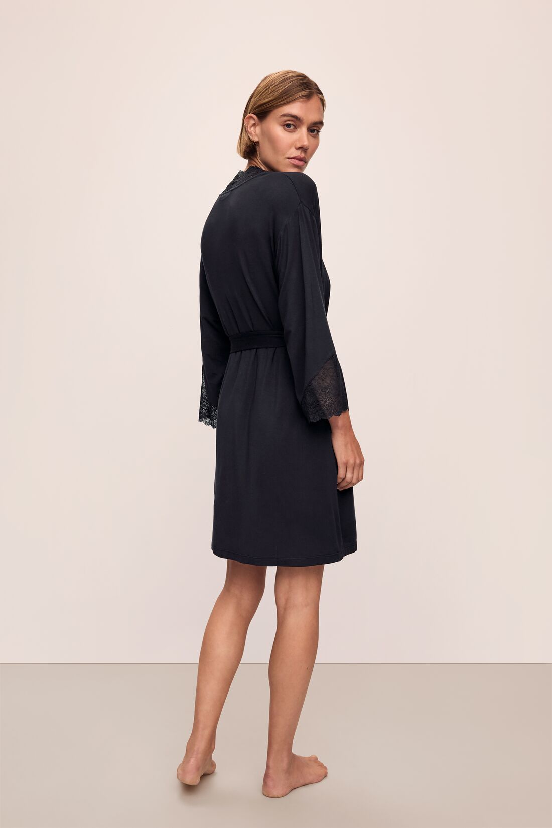 Back image of model wearing Lara TENCEL Modal Short Robe in black