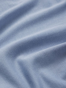 Model wears Gisele TENCEL Modal Boyfriend Sleepshirt in wedgewood blue.