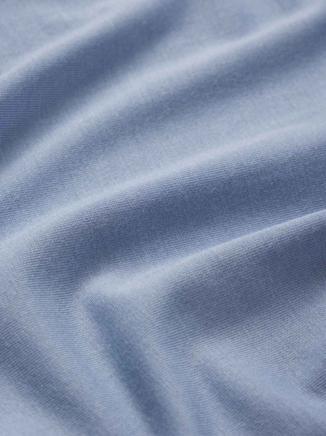 Model wears Gisele TENCEL Modal Boyfriend Sleepshirt in wedgewood blue.