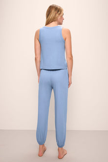 Model wears the Aloe Cotton Pant in Wedgewood Blue.