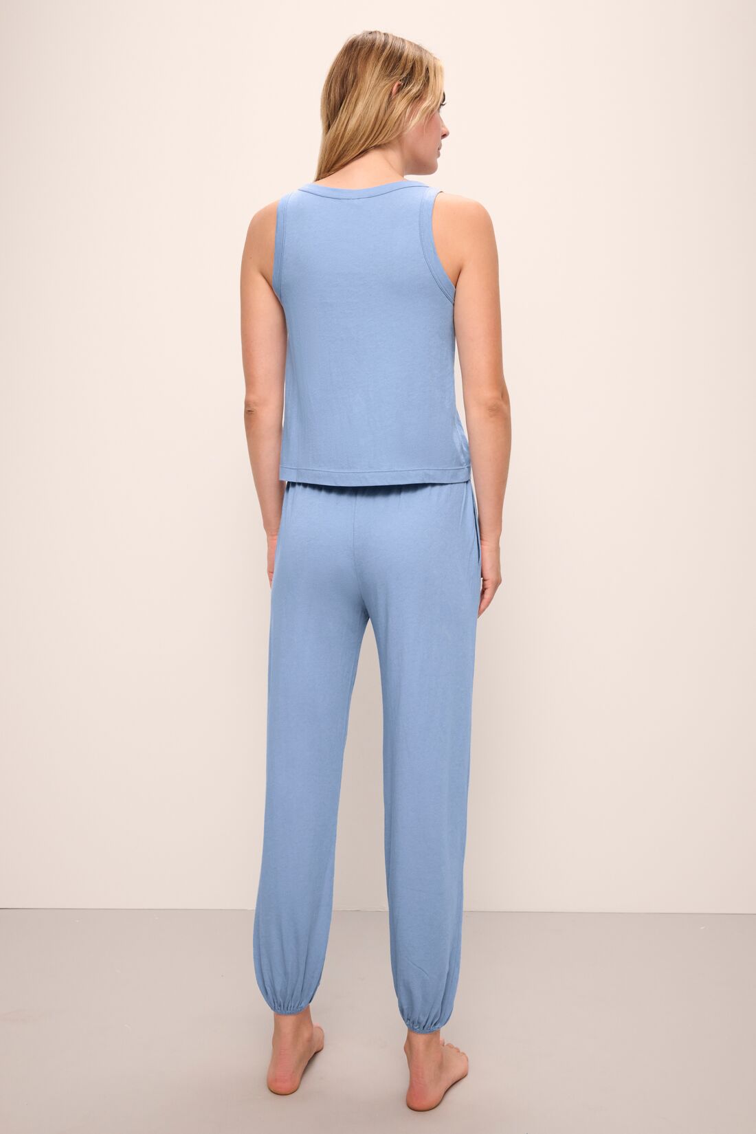 Model wears the Aloe Cotton Pant in Wedgewood Blue.