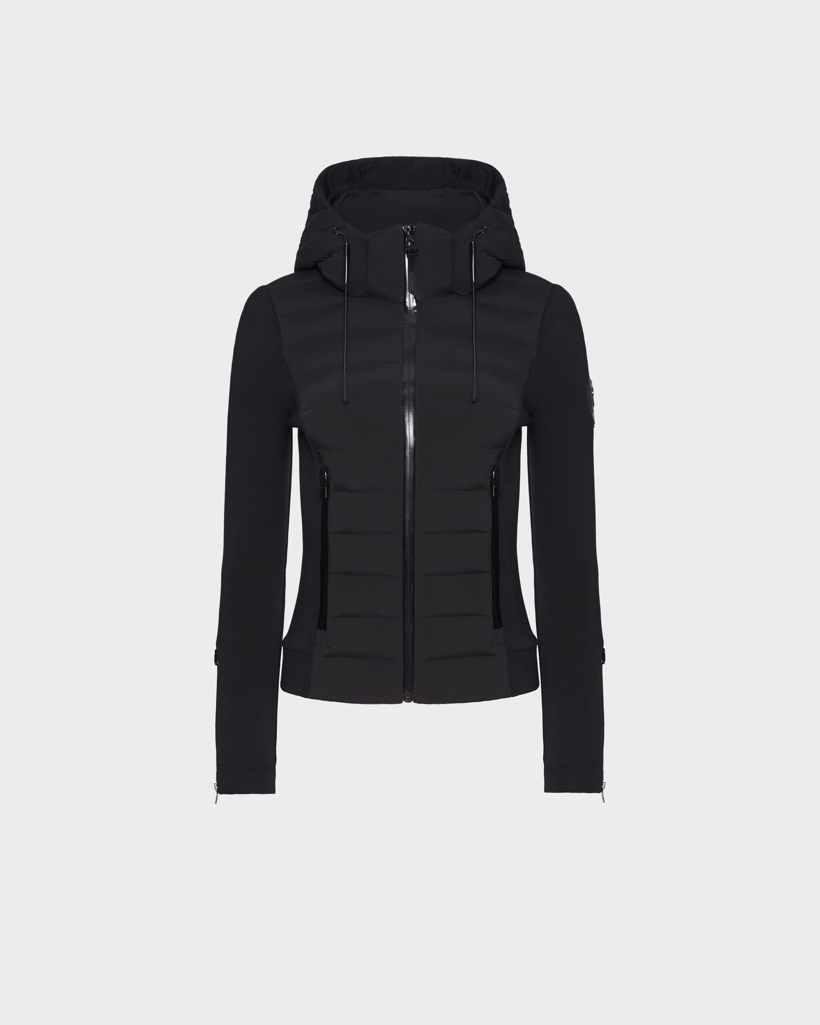 The RUDSAK MABS - 8122553 BLACK is a sleek, fitted women’s puffer jacket with a hood, full front zipper, horizontal quilting, zippered side pockets, and long sleeves. Displayed on a plain white background.