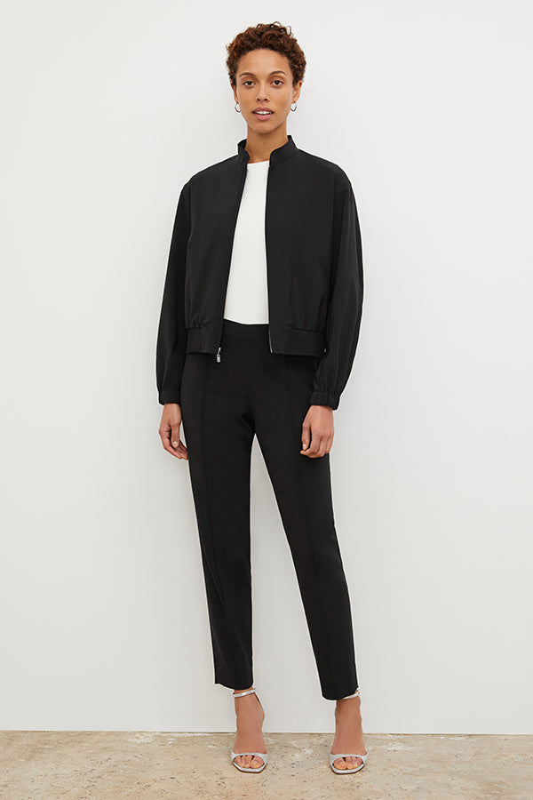 Front image of a woman standing wearing the Colby Jogger in Black | Exclude
