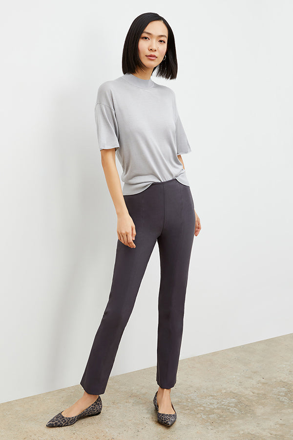 Side image of a woman standing wearing the foster pant in monsoon | Exclude