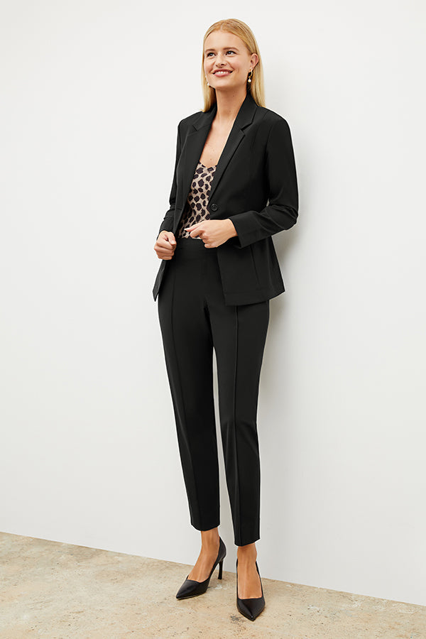 Front image of a woman standing wearing the Colby Jogger in Black | Exclude