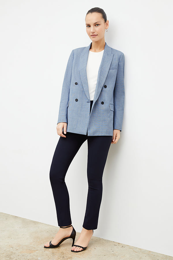 Front image of a woman standing wearing the foster pant in dark navy | Exclude