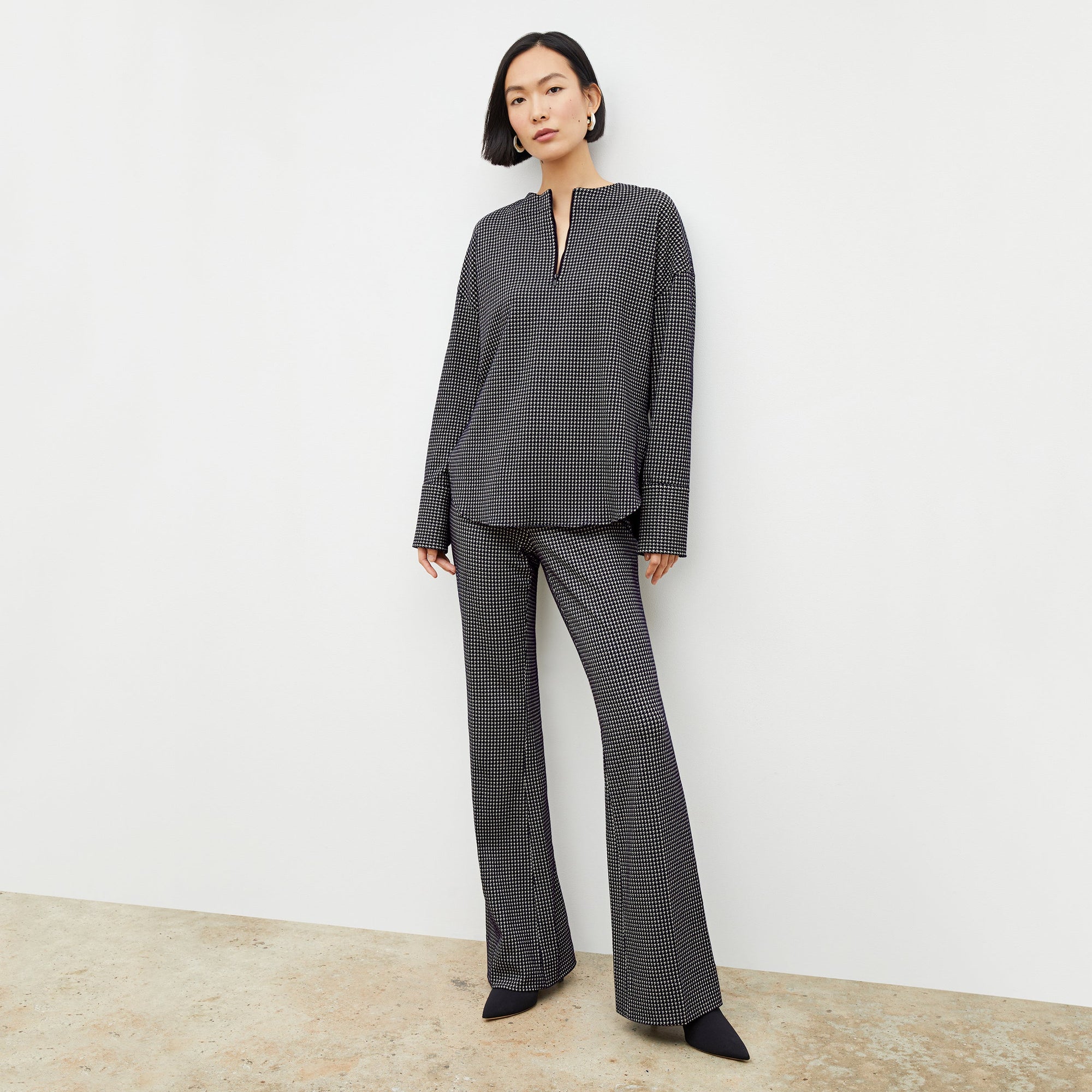 Front image of a woman wearing the tully top in black and white