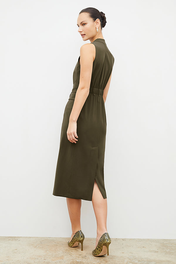 Back image of a woman wearing the Cassandra dress in origamitech in olive | Exclude | Grid Hover