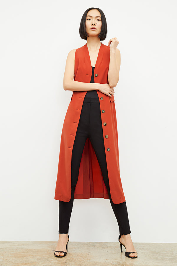 Front image of a woman standing wearing the curie pant in black | Exclude