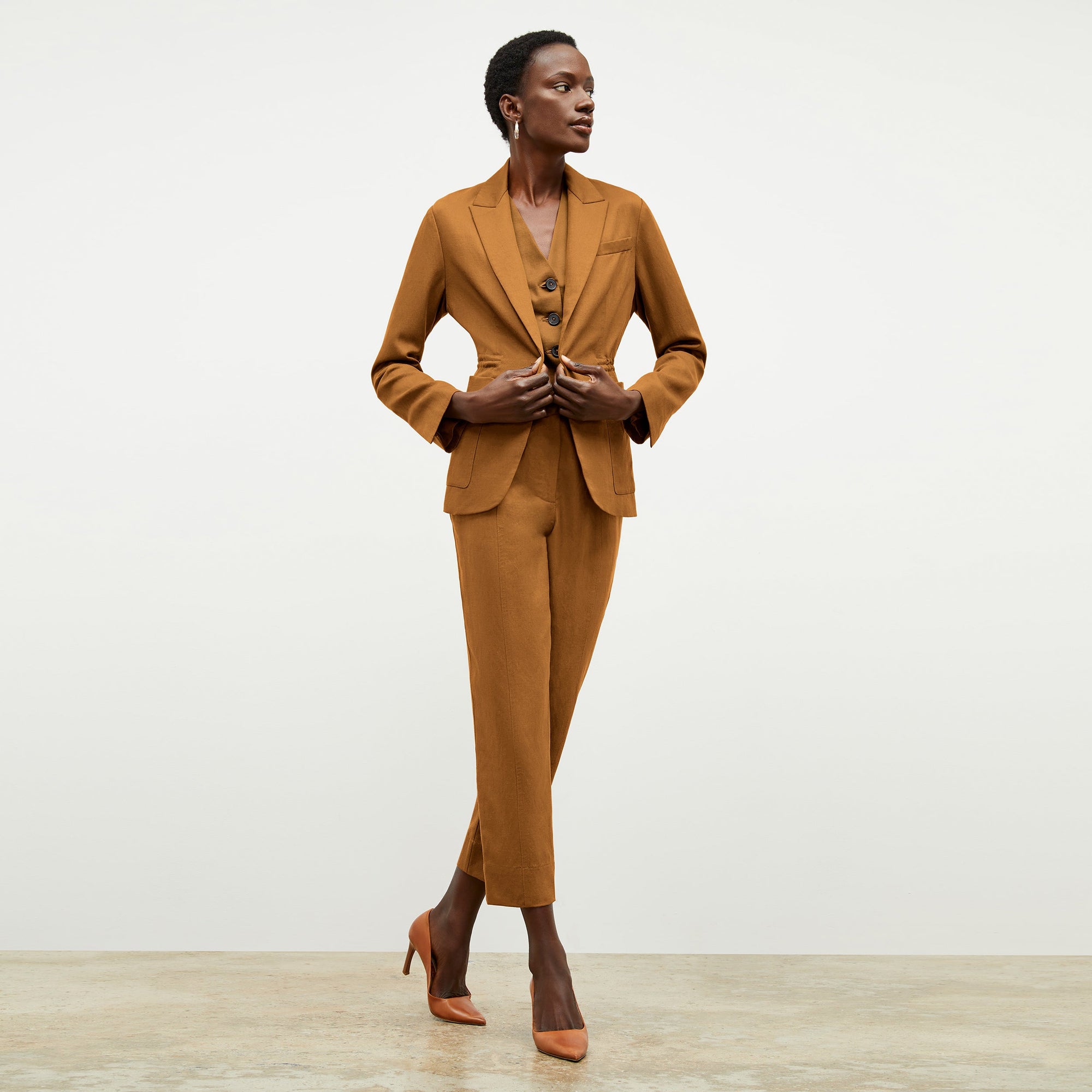 Front image of a woman wearing the Shane Pant in Acorn 