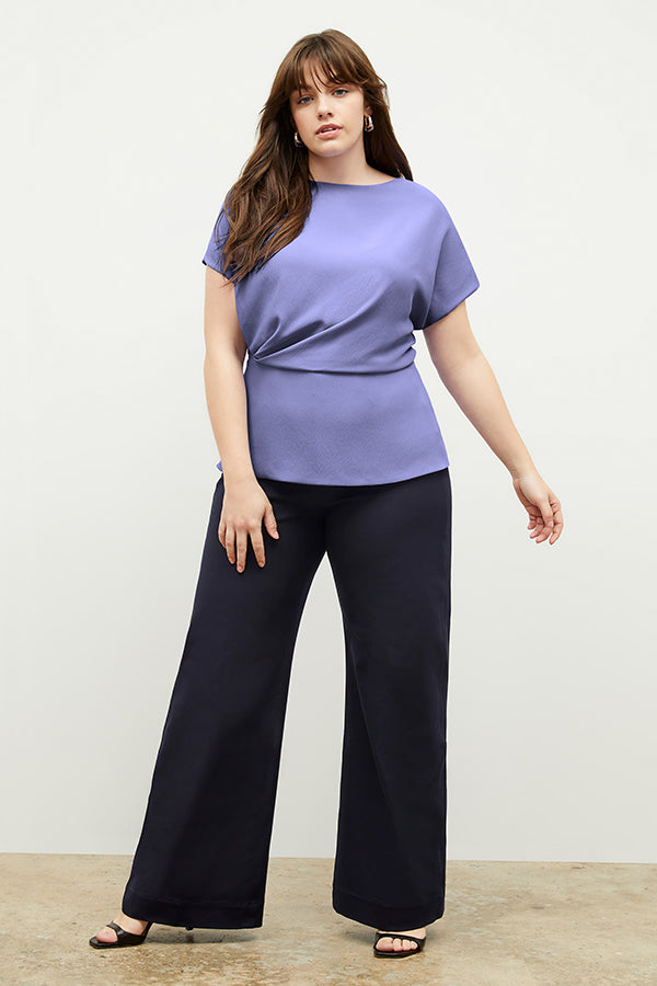 Front image of a woman standing wearing the Milo Jean in ink | Exclude