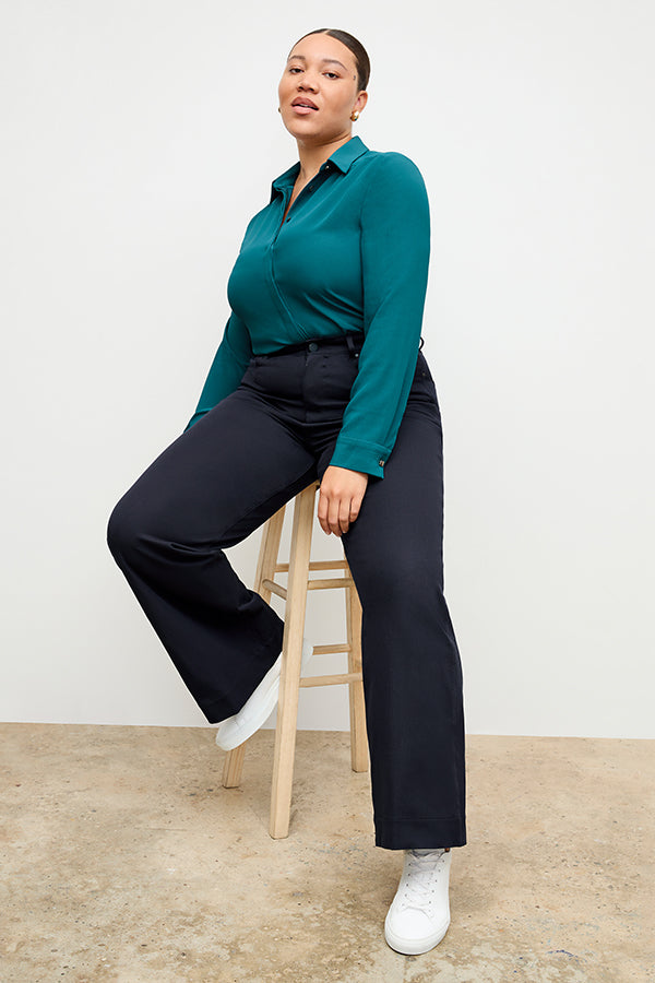 Front image of a woman standing wearing the Milo Jean in ink | Exclude