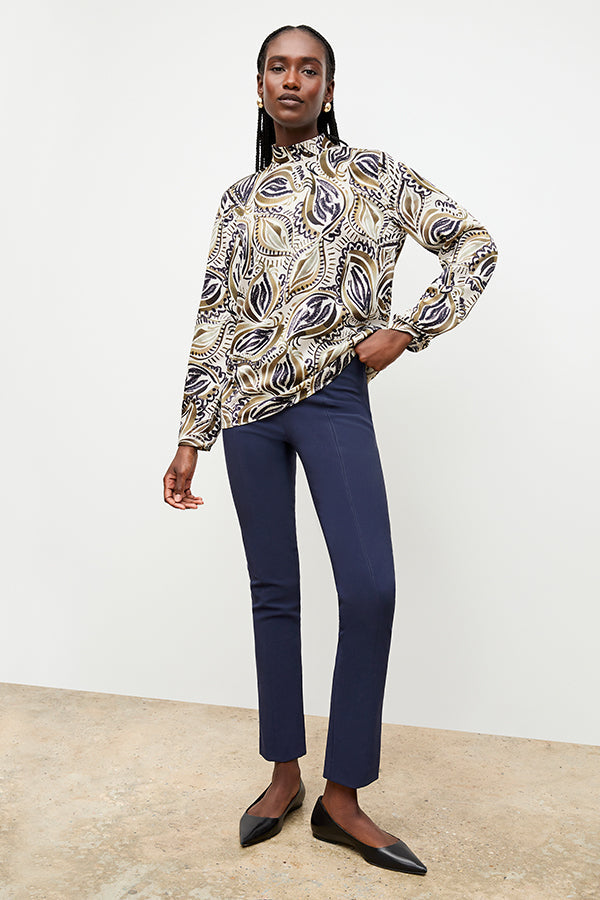 Front image of a woman standing wearing the foster pant in dark navy | Exclude