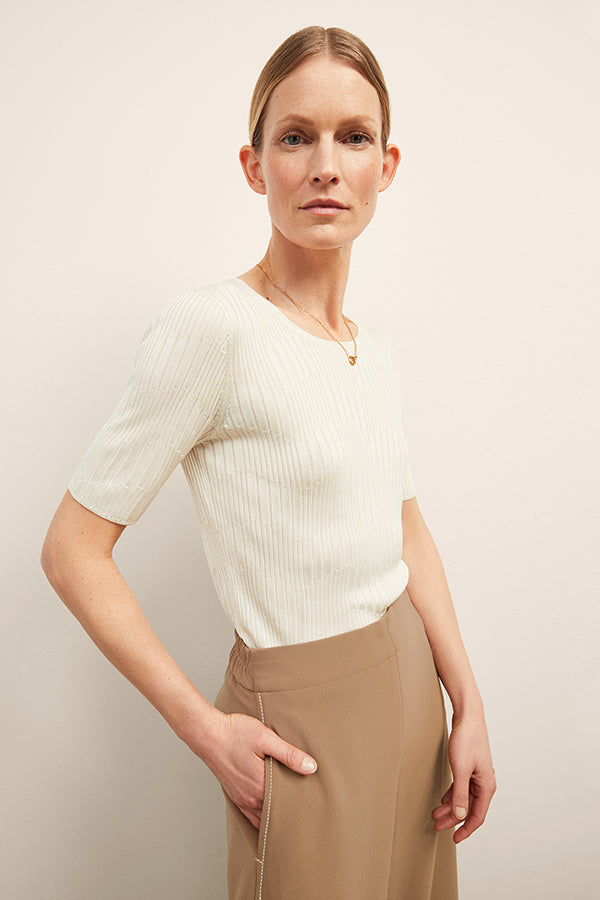 front image of a woman wearing the charlie top in ivory | Exclude