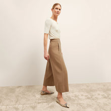 front image of a woman wearing the charlie top in ivory