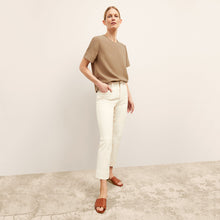 front image of a woman wearing the annika top in saddle