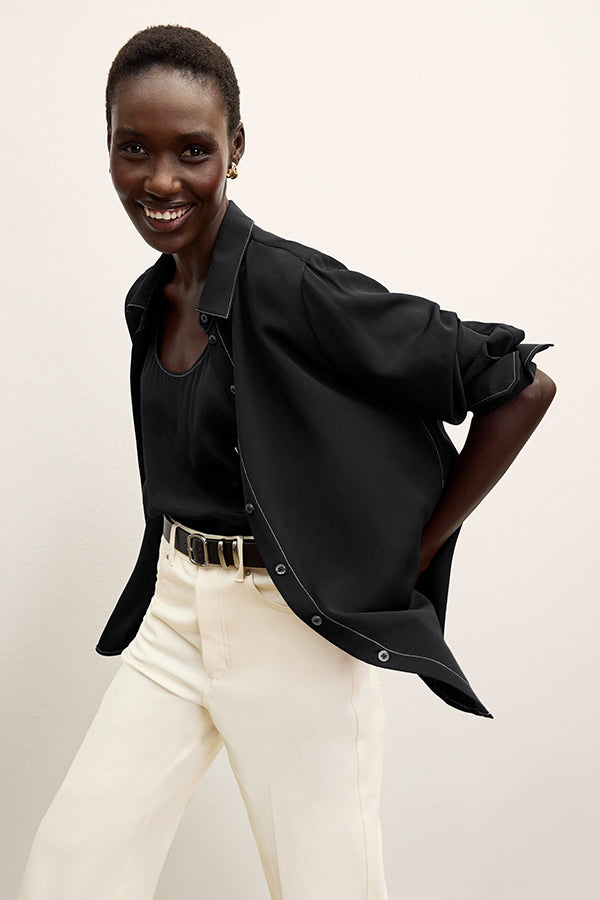 front image of a woman wearing the mira top in black | Exclude
