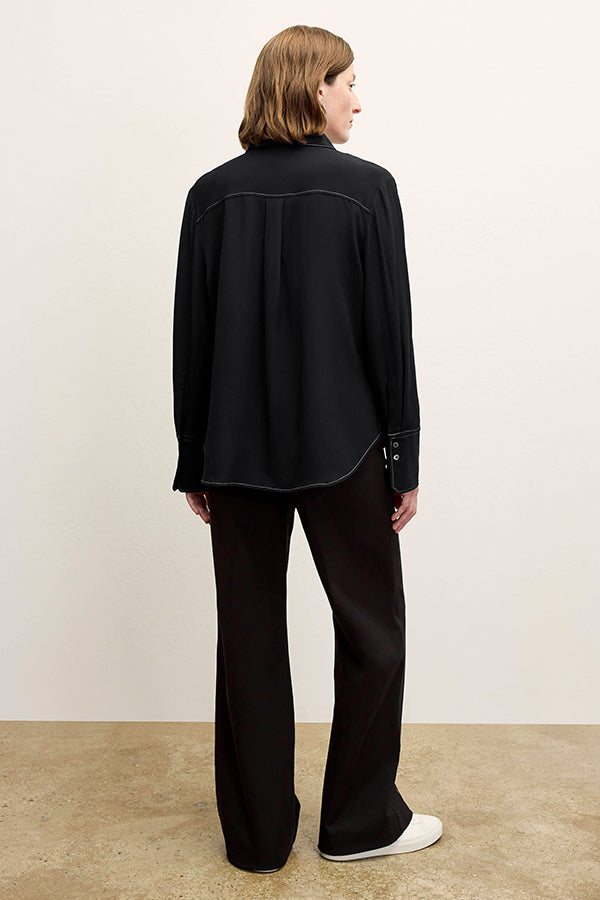 front image of a woman wearing the mira top in black | Exclude