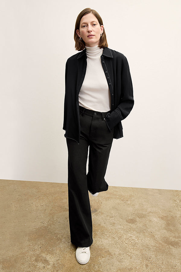 front image of a woman wearing the mira top in black | Exclude
