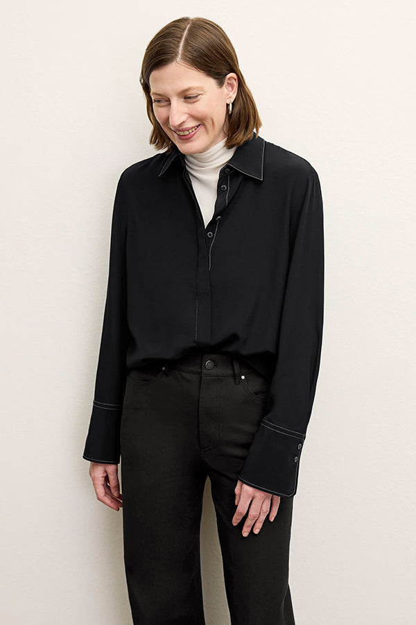 front image of a woman wearing the mira top in black | Exclude | Grid