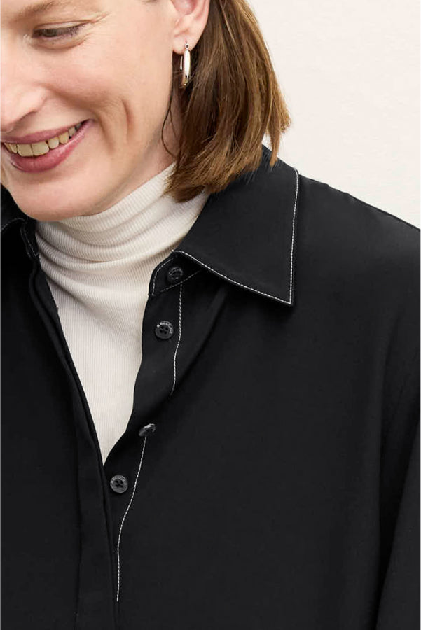front image of a woman wearing the mira top in black | Exclude