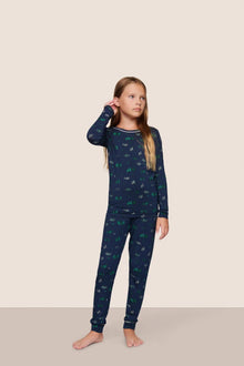 Model is wearing Kids Printed TENCEL Modal Unisex Long PJ Set  in Forest Pine Navy/Ivory