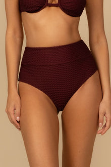 Maroon crochet high-rise bikini bottom with textured fabric and full coverage design.