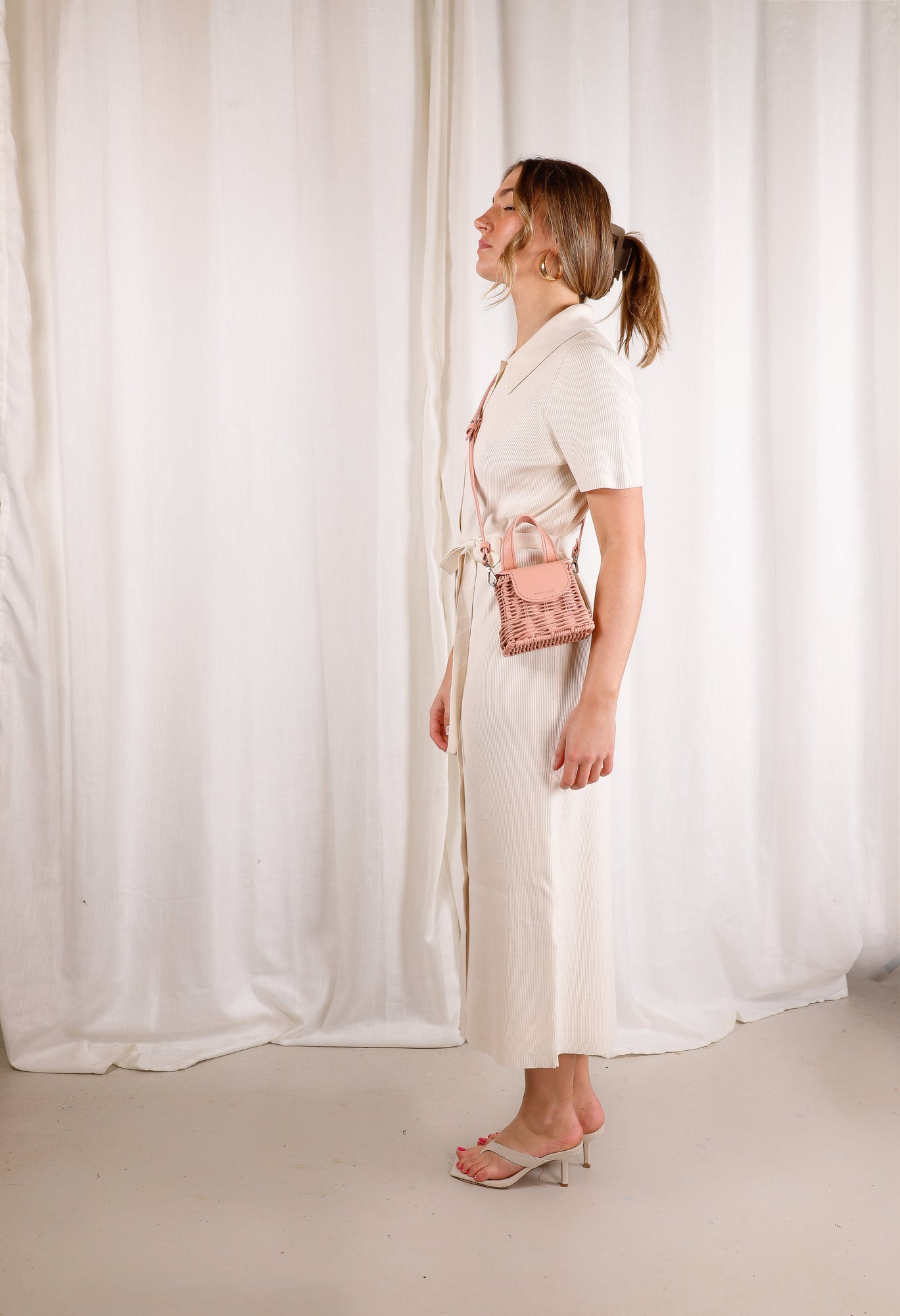 Micro Bag-Peach-Front-WickerWings-WickerHandbag-RattanBag-Handbag-Bag-BlackBag-ShoulderBagForWomen-BlackShoulder-Bag-StrawBag-EcoFriendlyPurses-BeachBag-HolidayBag-Purse-Tote-Satchel