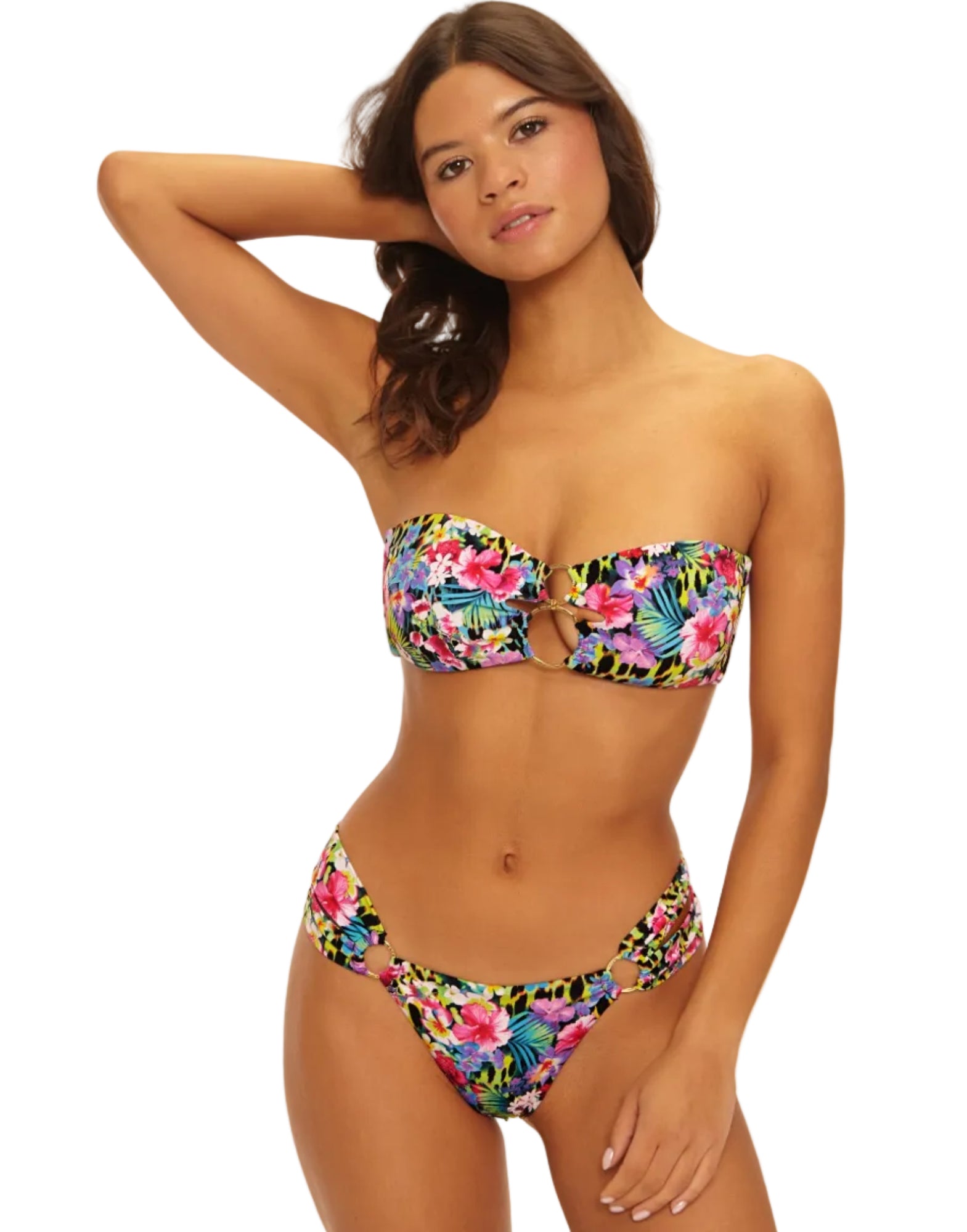 Woman wearing a colorful floral bikini on a white background