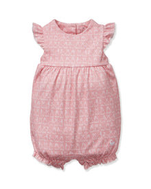 Baby's Pima Isla Play Romper in Hoppy Days Pink features flutter sleeves, ruffled leg openings, a gathered waist, and an allover white bunny outline print. Shown laid flat on a white background.